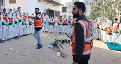Gazze&rsquo;deki Şifa Hastanesi&rsquo;nin avlusuna g&ouml;m&uuml;len 98 cenaze kimlik tespiti i&ccedil;in &ccedil;ıkarıldı